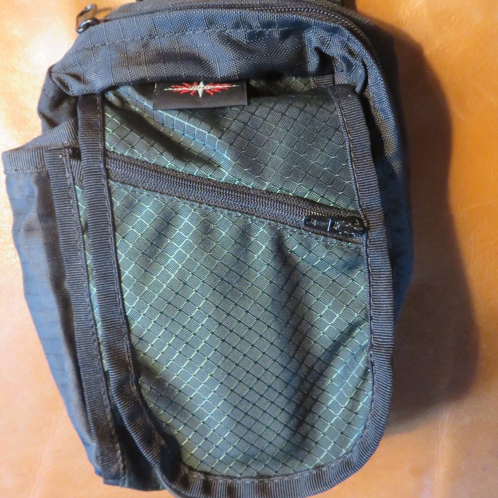 Small green/black nylon crossbody travel/hike bag
